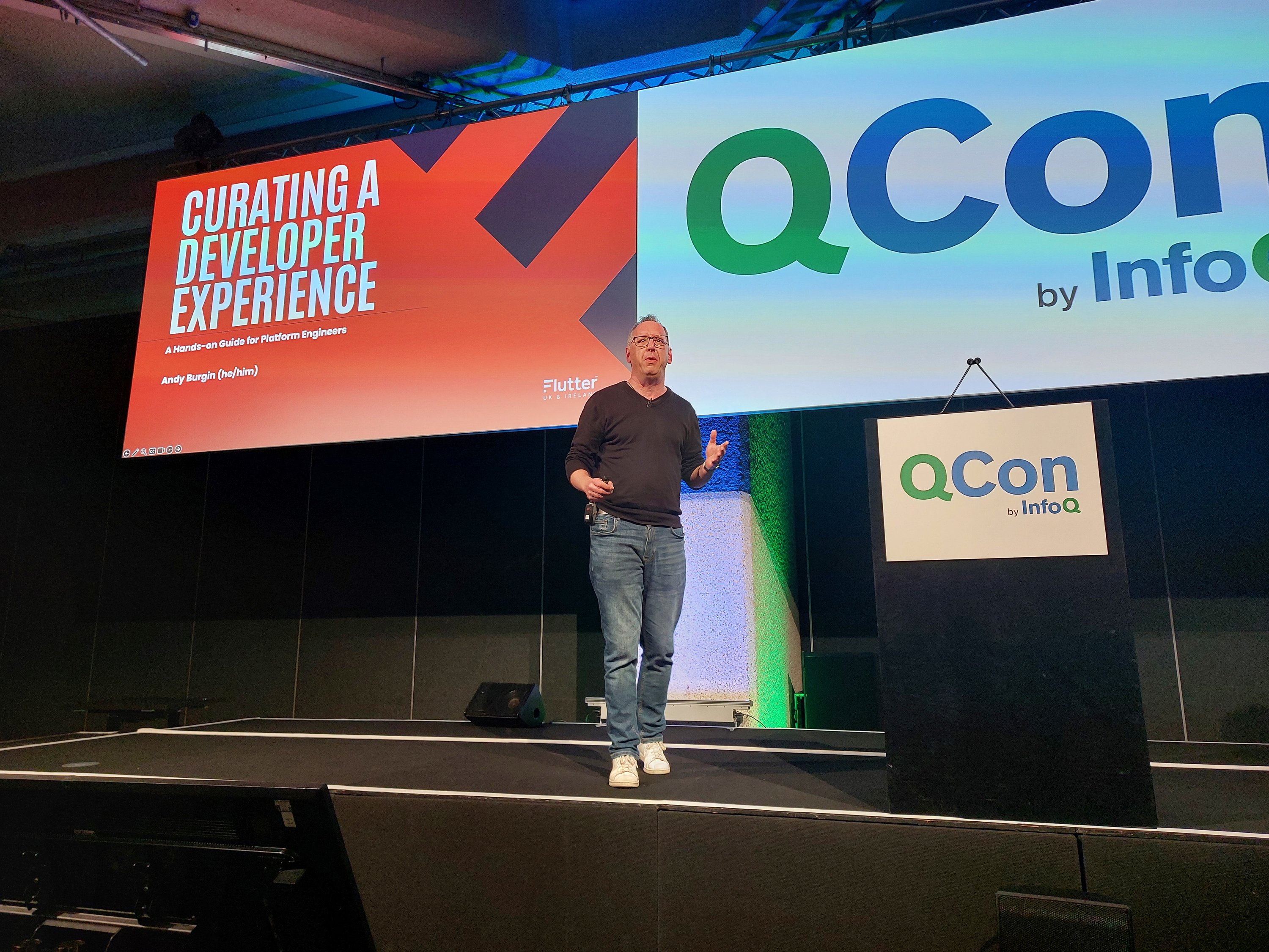 Andy Burgin on stage at QCon London 2024